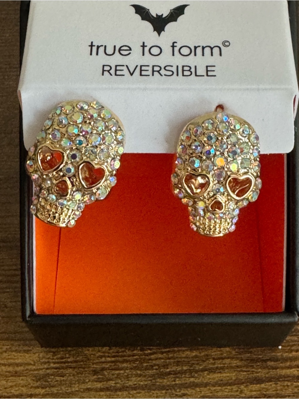 True to Form Gold Skull Stud Earrings with Red Heart Eyes